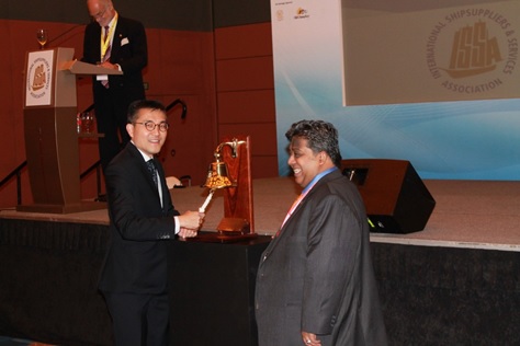 Mr Andrew Tan rings the ISSA Bell to declare Convention open watched by ISSA President Mr Abdul Hameed Hajah